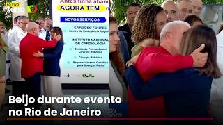 Janja arrives unexpectedly and gives Lula a big kiss during a government event.