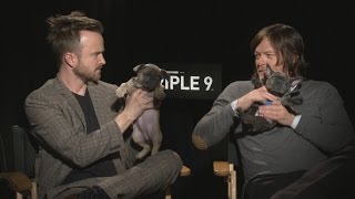 Watch Aaron Paul and Norman Reedus Give an Entire Interview While Holding Tiny Puppies