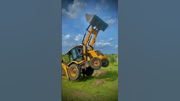JCB backhoe loader loading a truck with material using the front bucket. #tractor #jcb #shortvideo