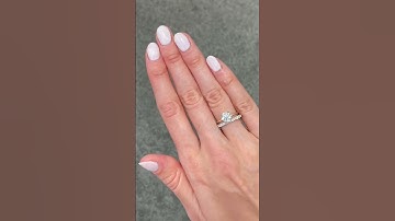 Beautiful round solitaire engagement ring & matching micro set wedding band