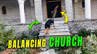 3 Guys Balancing Themselves While Walking into a Leaning Church
