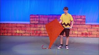 Peyton Podgorski as Charlie Brown, singing &quot;The Kite&quot;