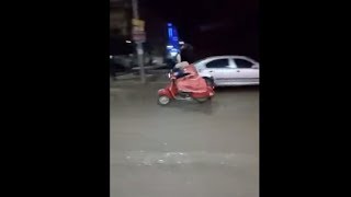 Woman Driving Her Motorbike In A Minnie Mouse Costume
