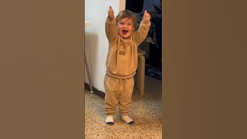 Little boy tries to figure out how to give a thumbs up 😂