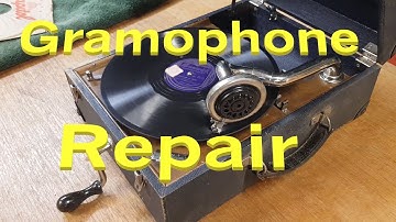 Repairing the brake mechanism on a 1920s portable wind-up gramophone. A quick fix and inspection