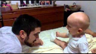 Baby laughing / playing with his daddy