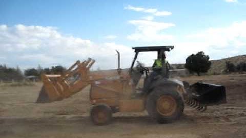 Santana Delao demonstrating start up procedures for Case 570 MXT Skip Loader Grader