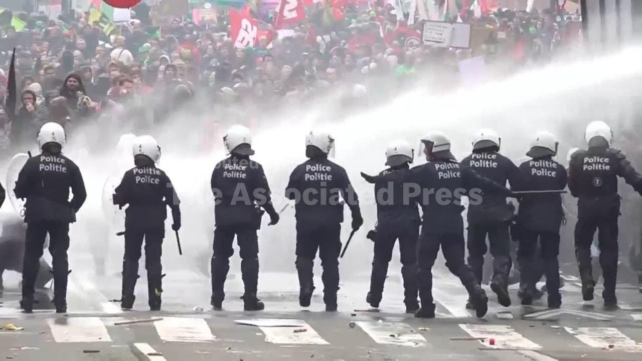 Belgian police use water cannon to move on protesters in Brussels on day of union strike