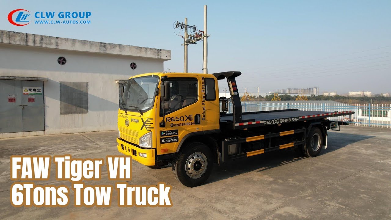 Professional tilt tray tow truck showing loading mechanism