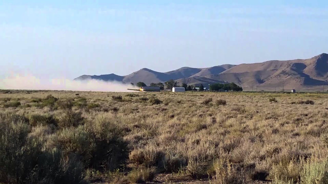 Crop duster take off.        Howe, Idaho