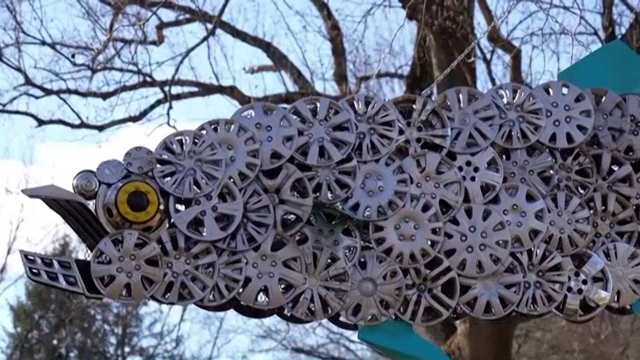 Baltimore Cyclist Collects Lost Hubcaps, Turns Them Into Art - YouTube