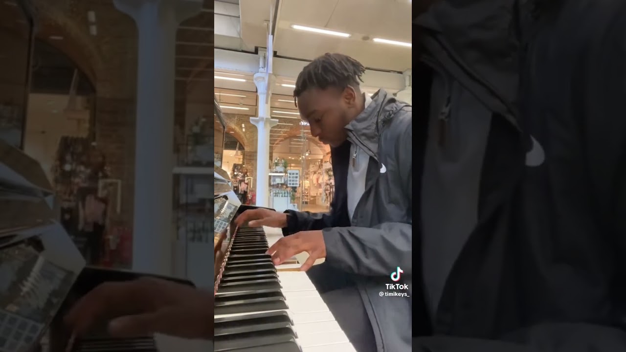 man playing iconic rap songs on piano 