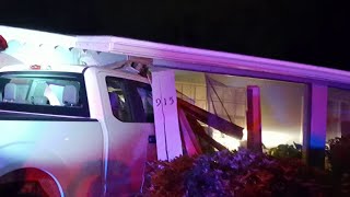 Car crashes into home after chase, officials say