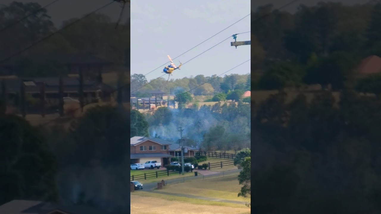 Huey Helicopter helping with emergency bushfire control in Orchard Hills. Australia.