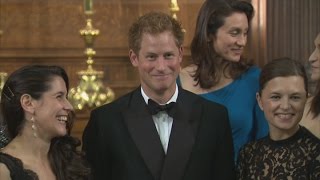 Harry jokes about being seated between men at women's gala dinner