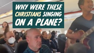 Why did Christians sing worship music on a plane?