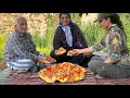 "Making a GIANT Pizza Over Fire in a Remote Nomadic Village!"