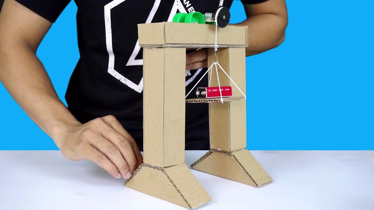 5-Cent Lab - DIY Cardboard Crane Kids used the pulley as pizza cutter and  now wanted to put together a crane following the picture in the book.  #cardboardcrafts #cranetruck