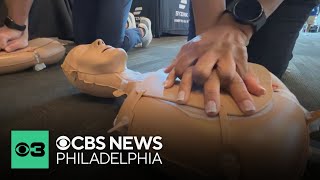 Football coaches gather in Lincoln Financial Field to learn CPR techniques