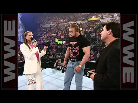 Stephanie McMahon and Eric Bischoff vie for the contract of