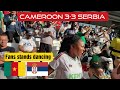 Cameroon girl dancing with football fans on stadium stand in match vs serbia