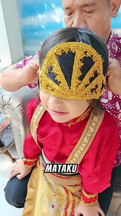 When Papa Ara Puts on Bagas' Acehnese Traditional Costume Crown for the Independence Carnival. In...