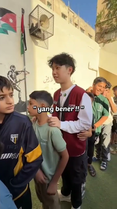 WILLIE SALIM IS ANNOYED BEING TOLD TO LINE UP OR GET PINCHED BY A PALESTINIAN BOY WHO IS CAPRICULAR
