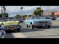 Lowriders cruising broadway