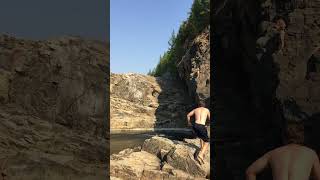 Guy clips jumps and does several backflips and lands on back