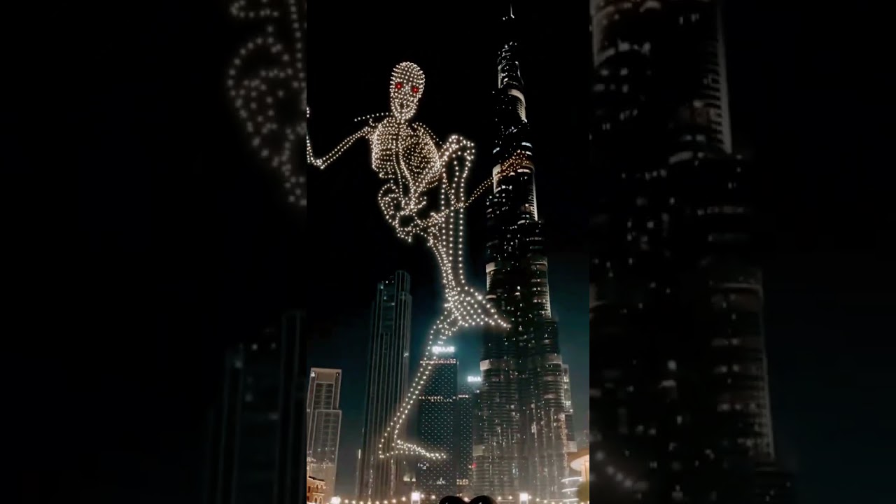Skeleton climbs Burj Kalifa. Halloween in Dubai UAE. Drones holograms.