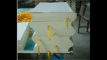 Book spine rounding and backing machine