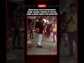 On Cam: Man Catches Python Snake With Bare Hands Rides Away On Scooter With Snake Wrapped On His Arm