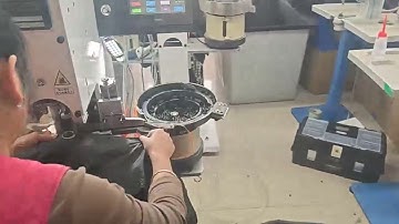 autmoatic snap button fixing machine video from our customer garment factory producing thick jacket
