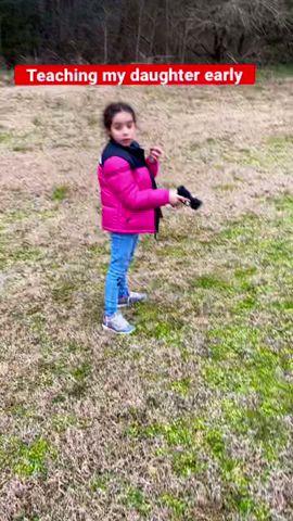 My daughter shooting her first gun. (G2C)