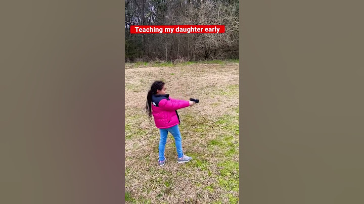 My daughter shooting her first gun. (G2C)