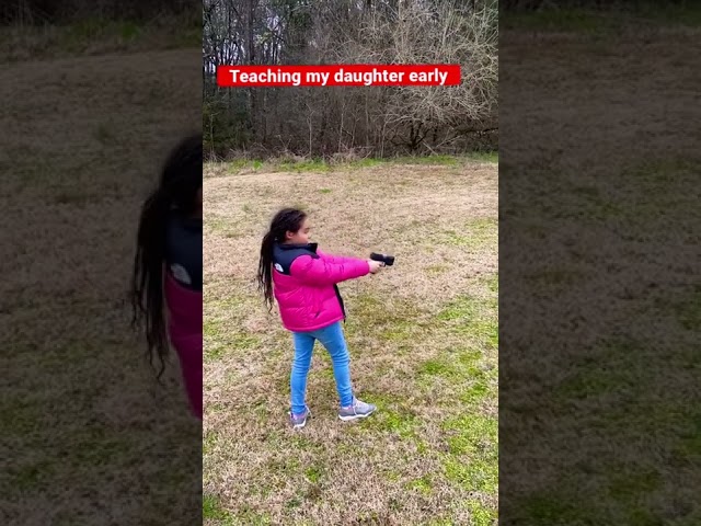 My daughter shooting her first gun. (G2C) class=