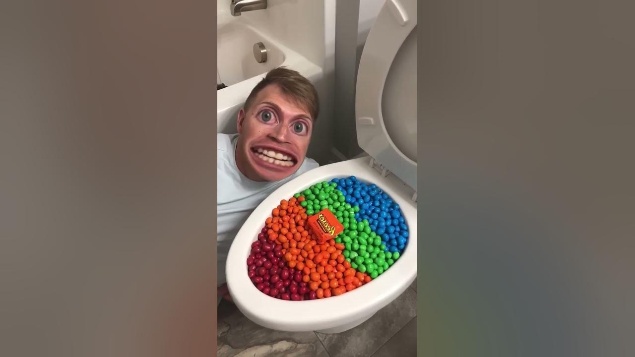 Eating Colorful Chocolate M&M's Candy in Toilet