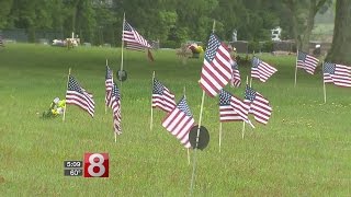 Veterans place flags at graves of other veterans