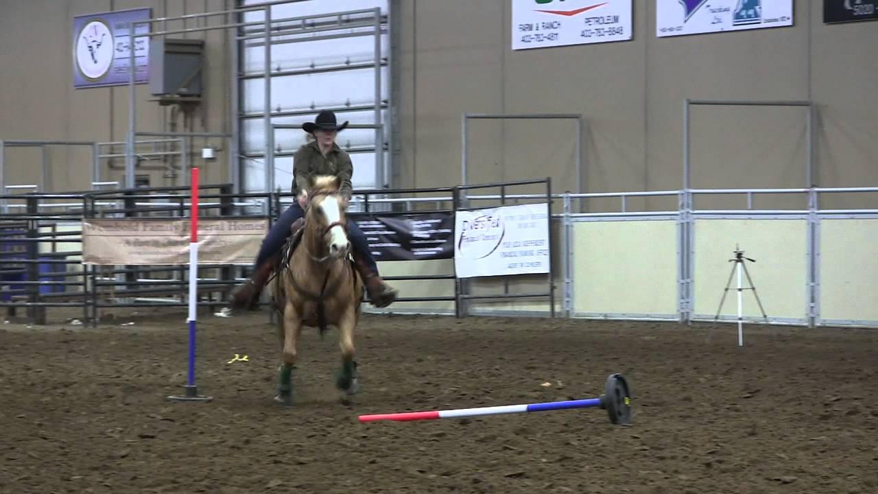 Leah Olstad knocks in the Pole Bending at Canada's 2012 Ultimate Cowgirl Challenge in Ponoka, AB