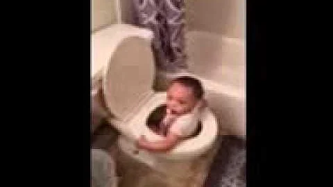 Layla swims in the potty.