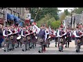 2019 Street Parade of 11 Pipe Bands marching through Pitlochry town centre in Perthshire, Scotland