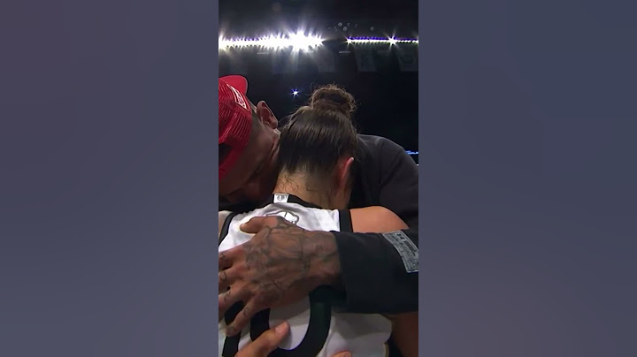 Kelsey Plum and Darren Waller embrace