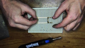 Soldering slot car chassis using a ceramic block