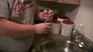 Exploding the bottom of a glass bottle by hitting the top