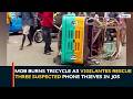Plateau Security: Mob Burns Tricycle As Vigilantes Rescue Three Suspected Phone Thieves In Jos