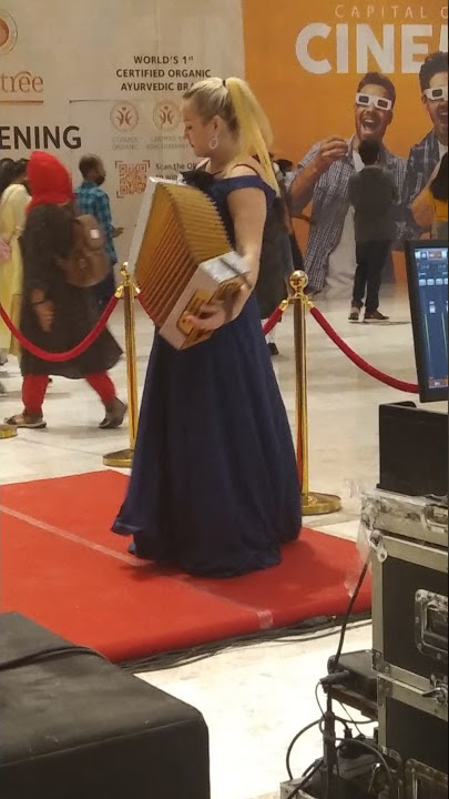 beautiful lady playing accordion in lulu mall.               #accordion #lulutvm #trivians #malayali