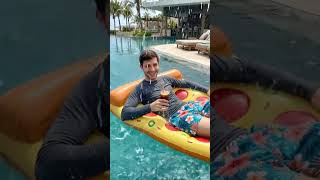 Heavy tropical rain begins splashing into the pool water surface. #pool #pizza #shorts