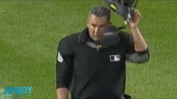 Keon Broxton hits the ump in the face with his bat...
