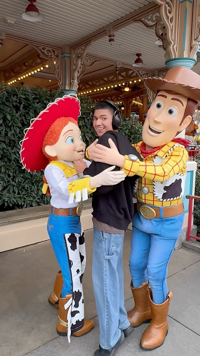 Thomas getting a hug from Woody and Jessie at the same time #shorts #disneyland #autism