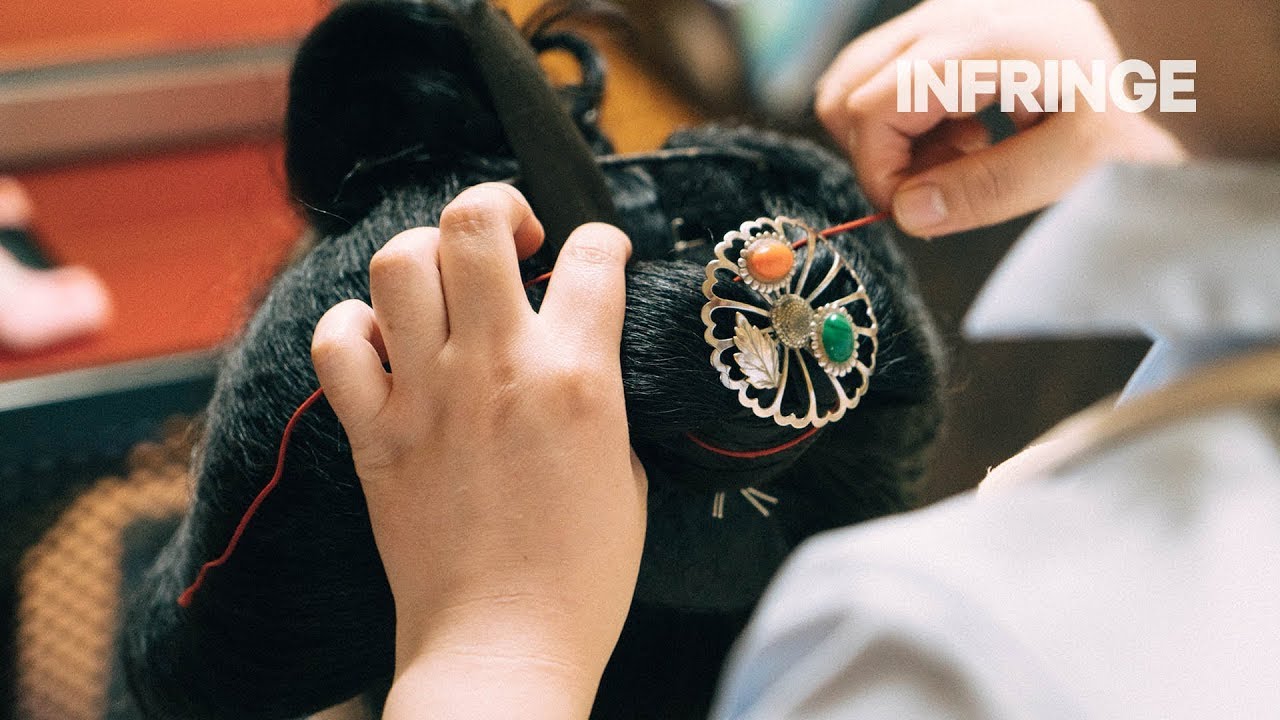 A rare look at the creation of a traditional hairstyle of a Geiko-in-training
